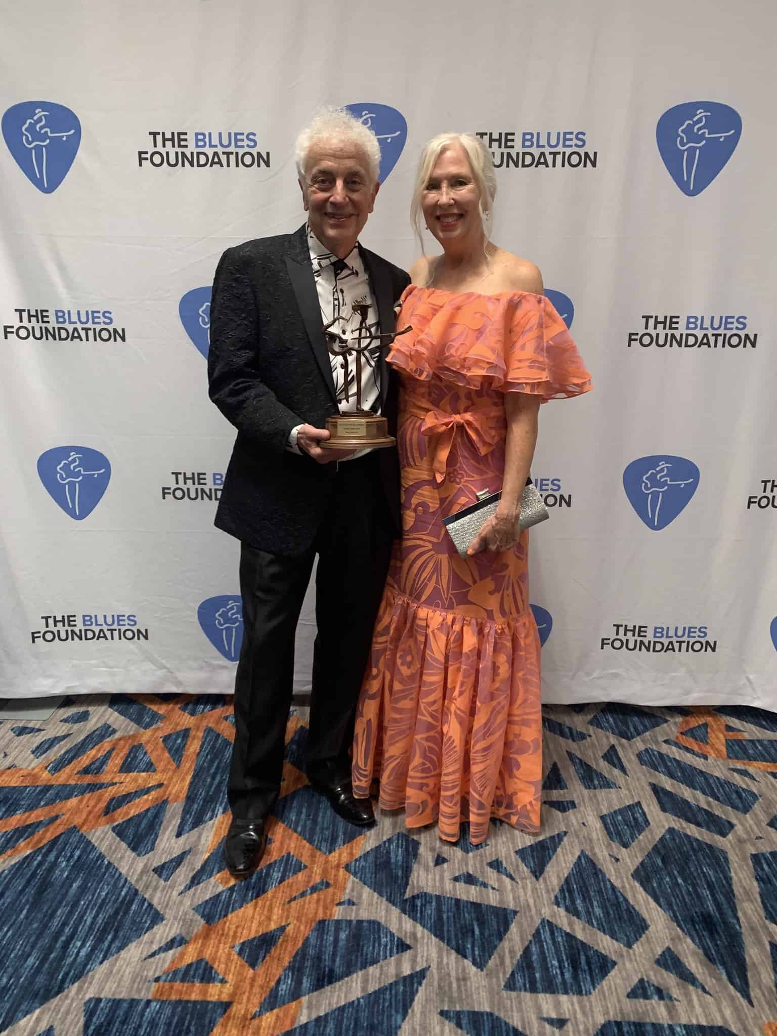 Doug MacLeod Accepts His Blues Music Award 2023 - photo with trophy and his wife, Patti Joy MacLeod