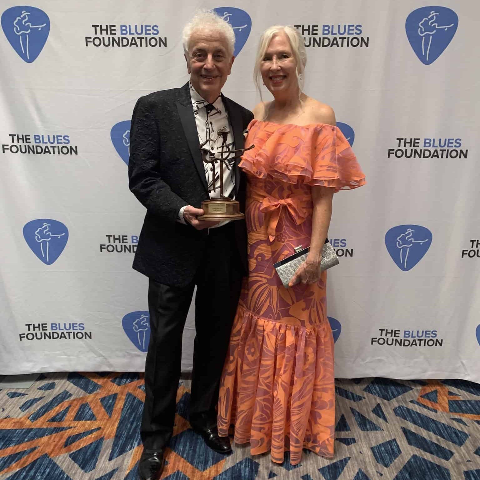 Doug MacLeod Accepts His Blues Music Award 2023 - photo with trophy and his wife, Patti Joy MacLeod